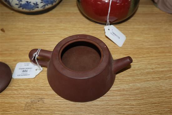 A Chinese squat baluster vase, crackle-glazed in green and red, a blue and white ginger jar and cover and a redware teapot